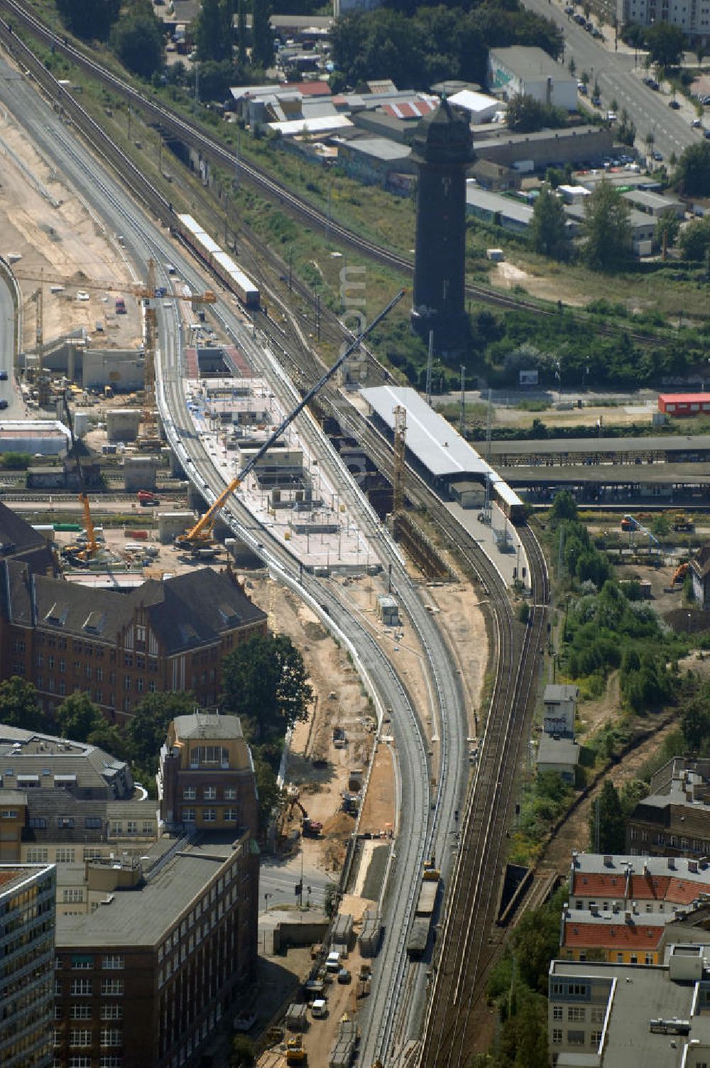 Aerial photograph Berlin - Blick auf den Um- und Neubau des Berliner S-Bahnhofs Ostkreuz. Der Bahnhof wurde bereits im Jahr 1882 eröffnet und ist somit stark sanierungsbedürftig. Teile der Neubauten führt die EUROVIA Beton GmbH aus. Weiterhin beteiligt ist das Unternehmen VEPRO Verkehrsbauprojekt GmbH. Kontakt EUROVIA: EUROVIA BEton GmbH, Niederlassung Ingenieurbau und Zweigniederlassung Cottbus, Gewerbeparkstraße 17, 03099 Kolkwitz, Tel. +49(0)355 35552 3, Fax +49(0)355 35552 52, EMail: ingenieurbau@eurovia.de; Kontakt VEPRO: Verkehrsbau Projekt GmbH, Storkower Str. 132, 10407 Berlin, Tel. +49(0)30 42194 0, Fax +49(0)30 42194 221