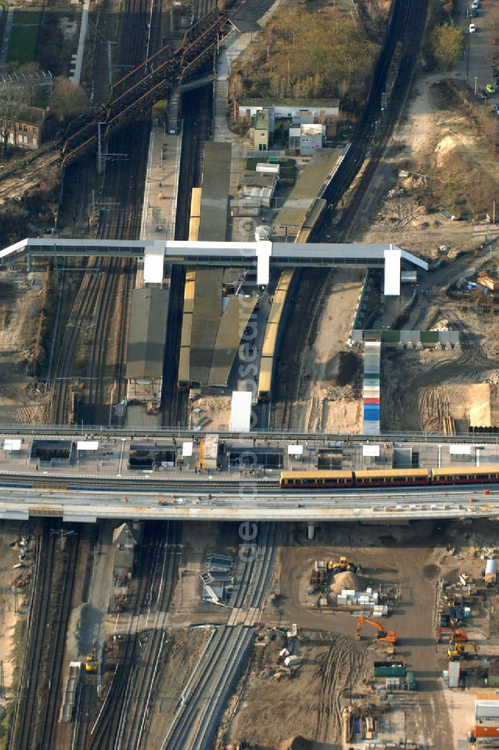 Aerial photograph Berlin - Blick auf den Um- und Neubau des Berliner S-Bahnhofs Ostkreuz. Der Bahnhof wurde bereits im Jahr 1882 eröffnet und ist somit stark sanierungsbedürftig. Teile der Neubauten führt die EUROVIA Beton GmbH aus. Weiterhin beteiligt ist das Unternehmen VEPRO Verkehrsbauprojekt GmbH. Kontakt EUROVIA: EUROVIA BEton GmbH, Niederlassung Ingenieurbau und Zweigniederlassung Cottbus, Gewerbeparkstraße 17, 03099 Kolkwitz, Tel. +49(0)355 35552 3, Fax +49(0)355 35552 52, EMail: ingenieurbau@eurovia.de; Kontakt VEPRO: Verkehrsbau Projekt GmbH, Storkower Str. 132, 10407 Berlin, Tel. +49(0)30 42194 0, Fax +49(0)30 42194 221