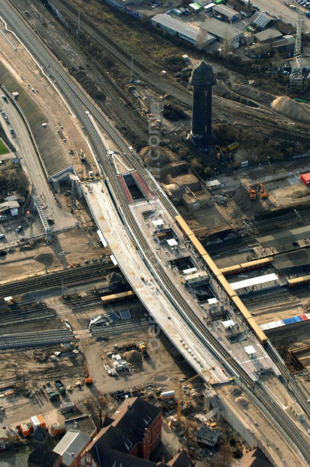 Aerial photograph Berlin - Blick auf den Um- und Neubau des Berliner S-Bahnhofs Ostkreuz. Der Bahnhof wurde bereits im Jahr 1882 eröffnet und ist somit stark sanierungsbedürftig. Teile der Neubauten führt die EUROVIA Beton GmbH aus. Weiterhin beteiligt ist das Unternehmen VEPRO Verkehrsbauprojekt GmbH. Kontakt EUROVIA: EUROVIA BEton GmbH, Niederlassung Ingenieurbau und Zweigniederlassung Cottbus, Gewerbeparkstraße 17, 03099 Kolkwitz, Tel. +49(0)355 35552 3, Fax +49(0)355 35552 52, EMail: ingenieurbau@eurovia.de; Kontakt VEPRO: Verkehrsbau Projekt GmbH, Storkower Str. 132, 10407 Berlin, Tel. +49(0)30 42194 0, Fax +49(0)30 42194 221