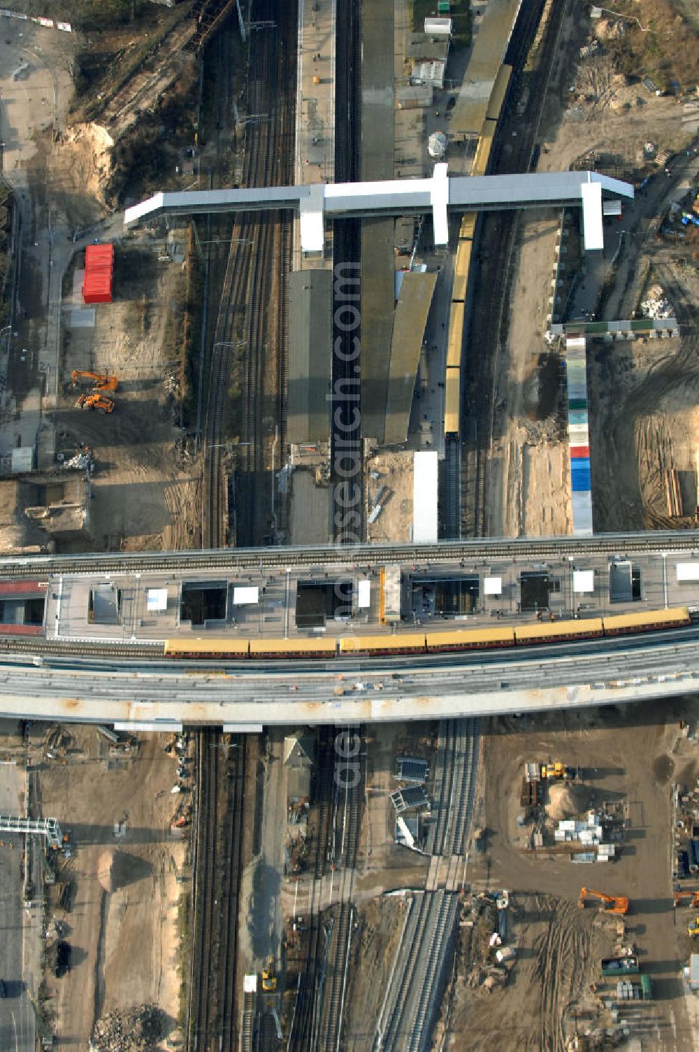 Aerial photograph Berlin - Blick auf den Um- und Neubau des Berliner S-Bahnhofs Ostkreuz. Der Bahnhof wurde bereits im Jahr 1882 eröffnet und ist somit stark sanierungsbedürftig. Teile der Neubauten führt die EUROVIA Beton GmbH aus. Weiterhin beteiligt ist das Unternehmen VEPRO Verkehrsbauprojekt GmbH. Kontakt EUROVIA: EUROVIA BEton GmbH, Niederlassung Ingenieurbau und Zweigniederlassung Cottbus, Gewerbeparkstraße 17, 03099 Kolkwitz, Tel. +49(0)355 35552 3, Fax +49(0)355 35552 52, EMail: ingenieurbau@eurovia.de; Kontakt VEPRO: Verkehrsbau Projekt GmbH, Storkower Str. 132, 10407 Berlin, Tel. +49(0)30 42194 0, Fax +49(0)30 42194 221