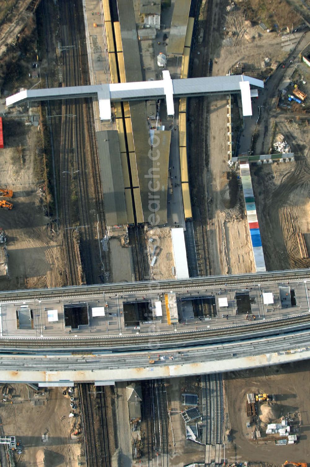 Aerial photograph Berlin - Blick auf den Um- und Neubau des Berliner S-Bahnhofs Ostkreuz. Der Bahnhof wurde bereits im Jahr 1882 eröffnet und ist somit stark sanierungsbedürftig. Teile der Neubauten führt die EUROVIA Beton GmbH aus. Weiterhin beteiligt ist das Unternehmen VEPRO Verkehrsbauprojekt GmbH. Kontakt EUROVIA: EUROVIA BEton GmbH, Niederlassung Ingenieurbau und Zweigniederlassung Cottbus, Gewerbeparkstraße 17, 03099 Kolkwitz, Tel. +49(0)355 35552 3, Fax +49(0)355 35552 52, EMail: ingenieurbau@eurovia.de; Kontakt VEPRO: Verkehrsbau Projekt GmbH, Storkower Str. 132, 10407 Berlin, Tel. +49(0)30 42194 0, Fax +49(0)30 42194 221