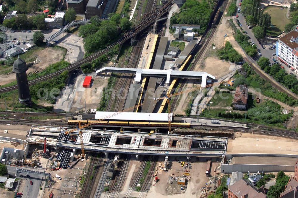 Aerial photograph Berlin - Blick auf den Um- und Neubau des Berliner S-Bahnhofs Ostkreuz. Der Bahnhof wurde bereits im Jahr 1882 eröffnet und ist somit stark sanierungsbedürftig. Teile der Neubauten führt die EUROVIA Beton GmbH aus. Weiterhin beteiligt ist das Unternehmen VEPRO Verkehrsbauprojekt GmbH. Kontakt EUROVIA: EUROVIA BEton GmbH, Niederlassung Ingenieurbau und Zweigniederlassung Cottbus, Gewerbeparkstraße 17, 03099 Kolkwitz, Tel. +49(0)355 35552 3, Fax +49(0)355 35552 52, EMail: ingenieurbau@eurovia.de; Kontakt VEPRO: Verkehrsbau Projekt GmbH, Storkower Str. 132, 10407 Berlin, Tel. +49(0)30 42194 0, Fax +49(0)30 42194 221