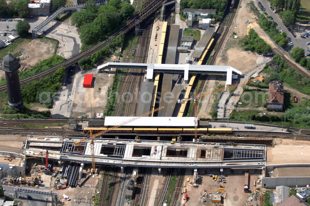 Aerial photograph Berlin - Blick auf den Um- und Neubau des Berliner S-Bahnhofs Ostkreuz. Der Bahnhof wurde bereits im Jahr 1882 eröffnet und ist somit stark sanierungsbedürftig. Teile der Neubauten führt die EUROVIA Beton GmbH aus. Weiterhin beteiligt ist das Unternehmen VEPRO Verkehrsbauprojekt GmbH. Kontakt EUROVIA: EUROVIA BEton GmbH, Niederlassung Ingenieurbau und Zweigniederlassung Cottbus, Gewerbeparkstraße 17, 03099 Kolkwitz, Tel. +49(0)355 35552 3, Fax +49(0)355 35552 52, EMail: ingenieurbau@eurovia.de; Kontakt VEPRO: Verkehrsbau Projekt GmbH, Storkower Str. 132, 10407 Berlin, Tel. +49(0)30 42194 0, Fax +49(0)30 42194 221