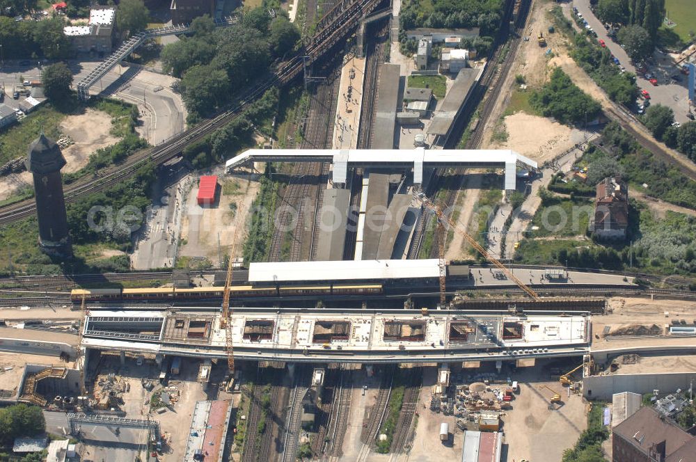 Aerial image Berlin - Blick auf den Um- und Neubau des Berliner S-Bahnhofs Ostkreuz. Der Bahnhof wurde bereits im Jahr 1882 eröffnet und ist somit stark sanierungsbedürftig. Teile der Neubauten führt die EUROVIA Beton GmbH aus. Weiterhin beteiligt ist das Unternehmen VEPRO Verkehrsbauprojekt GmbH. Kontakt EUROVIA: EUROVIA BEton GmbH, Niederlassung Ingenieurbau und Zweigniederlassung Cottbus, Gewerbeparkstraße 17, 03099 Kolkwitz, Tel. +49(0)355 35552 3, Fax +49(0)355 35552 52, EMail: ingenieurbau@eurovia.de; Kontakt VEPRO: Verkehrsbau Projekt GmbH, Storkower Str. 132, 10407 Berlin, Tel. +49(0)30 42194 0, Fax +49(0)30 42194 221