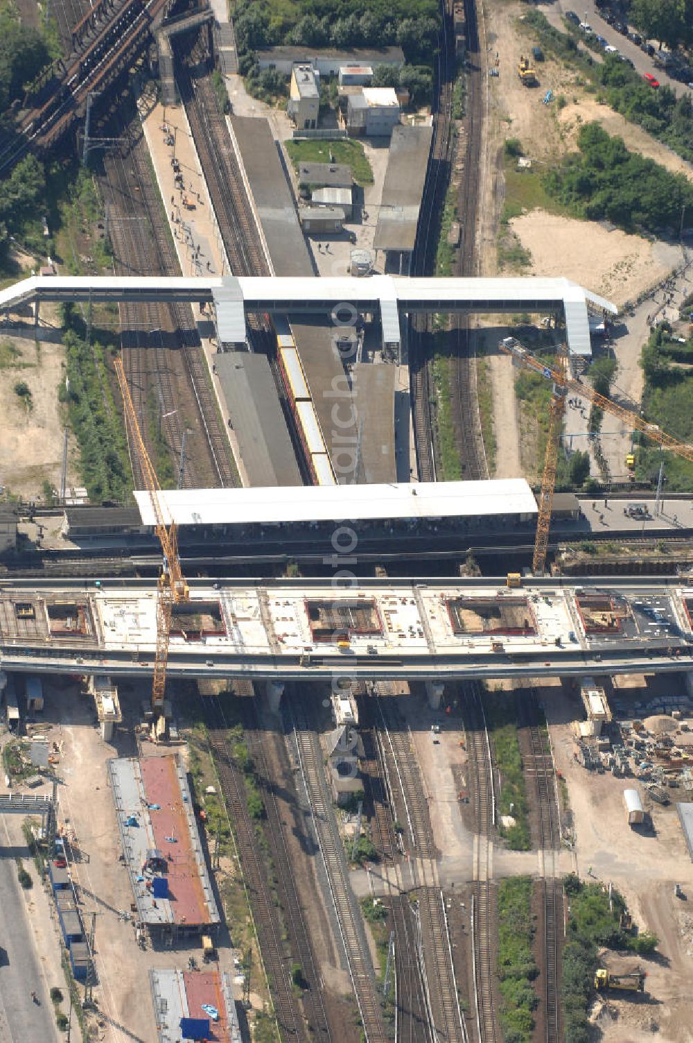 Aerial image Berlin - Blick auf den Um- und Neubau des Berliner S-Bahnhofs Ostkreuz. Der Bahnhof wurde bereits im Jahr 1882 eröffnet und ist somit stark sanierungsbedürftig. Teile der Neubauten führt die EUROVIA Beton GmbH aus. Weiterhin beteiligt ist das Unternehmen VEPRO Verkehrsbauprojekt GmbH. Kontakt EUROVIA: EUROVIA BEton GmbH, Niederlassung Ingenieurbau und Zweigniederlassung Cottbus, Gewerbeparkstraße 17, 03099 Kolkwitz, Tel. +49(0)355 35552 3, Fax +49(0)355 35552 52, EMail: ingenieurbau@eurovia.de; Kontakt VEPRO: Verkehrsbau Projekt GmbH, Storkower Str. 132, 10407 Berlin, Tel. +49(0)30 42194 0, Fax +49(0)30 42194 221