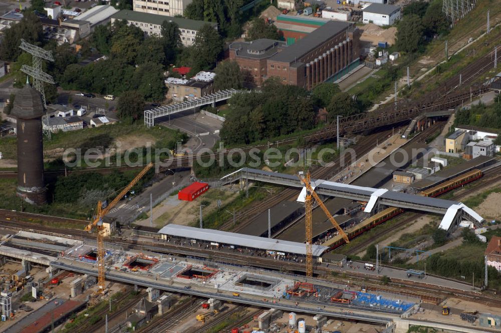 Aerial photograph Berlin - Blick auf den Um- und Neubau des Berliner S-Bahnhofs Ostkreuz. Der Bahnhof wurde bereits im Jahr 1882 eröffnet und ist somit stark sanierungsbedürftig. Teile der Neubauten führt die EUROVIA Beton GmbH aus. Weiterhin beteiligt ist das Unternehmen VEPRO Verkehrsbauprojekt GmbH. Kontakt EUROVIA: EUROVIA BEton GmbH, Niederlassung Ingenieurbau und Zweigniederlassung Cottbus, Gewerbeparkstraße 17, 03099 Kolkwitz, Tel. +49(0)355 35552 3, Fax +49(0)355 35552 52, EMail: ingenieurbau@eurovia.de; Kontakt VEPRO: Verkehrsbau Projekt GmbH, Storkower Str. 132, 10407 Berlin, Tel. +49(0)30 42194 0, Fax +49(0)30 42194 221