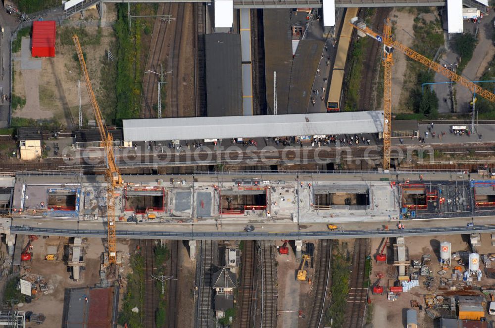 Aerial photograph Berlin - Blick auf den Um- und Neubau des Berliner S-Bahnhofs Ostkreuz. Der Bahnhof wurde bereits im Jahr 1882 eröffnet und ist somit stark sanierungsbedürftig. Teile der Neubauten führt die EUROVIA Beton GmbH aus. Weiterhin beteiligt ist das Unternehmen VEPRO Verkehrsbauprojekt GmbH. Kontakt EUROVIA: EUROVIA BEton GmbH, Niederlassung Ingenieurbau und Zweigniederlassung Cottbus, Gewerbeparkstraße 17, 03099 Kolkwitz, Tel. +49(0)355 35552 3, Fax +49(0)355 35552 52, EMail: ingenieurbau@eurovia.de; Kontakt VEPRO: Verkehrsbau Projekt GmbH, Storkower Str. 132, 10407 Berlin, Tel. +49(0)30 42194 0, Fax +49(0)30 42194 221