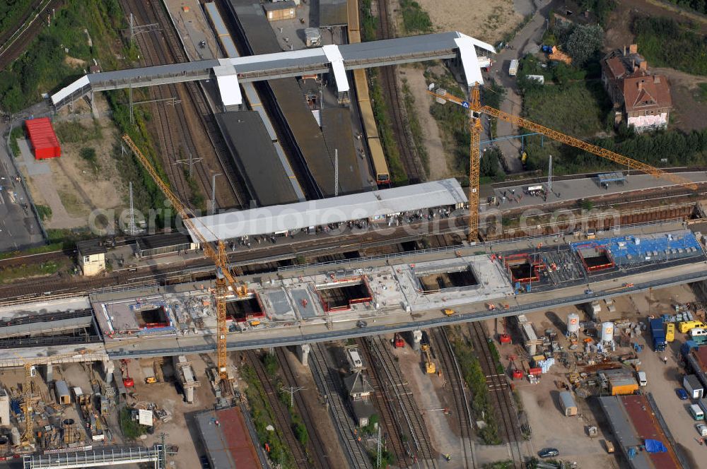 Aerial photograph Berlin - Blick auf den Um- und Neubau des Berliner S-Bahnhofs Ostkreuz. Der Bahnhof wurde bereits im Jahr 1882 eröffnet und ist somit stark sanierungsbedürftig. Teile der Neubauten führt die EUROVIA Beton GmbH aus. Weiterhin beteiligt ist das Unternehmen VEPRO Verkehrsbauprojekt GmbH. Kontakt EUROVIA: EUROVIA BEton GmbH, Niederlassung Ingenieurbau und Zweigniederlassung Cottbus, Gewerbeparkstraße 17, 03099 Kolkwitz, Tel. +49(0)355 35552 3, Fax +49(0)355 35552 52, EMail: ingenieurbau@eurovia.de; Kontakt VEPRO: Verkehrsbau Projekt GmbH, Storkower Str. 132, 10407 Berlin, Tel. +49(0)30 42194 0, Fax +49(0)30 42194 221