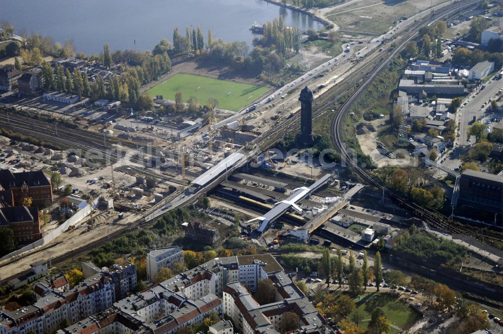 Aerial photograph Berlin - Blick auf den Um- und Neubau des Berliner S-Bahnhofs Ostkreuz. Der Bahnhof wurde bereits im Jahr 1882 eröffnet und ist somit stark sanierungsbedürftig. Die Arbeiten begannen im Oktober 2006. Teile der Neubauten führt die EUROVIA Beton GmbH aus. Weiterhin beteiligt ist das Unternehmen VEPRO Verkehrsbauprojekt GmbH. Kontakt EUROVIA: EUROVIA BEton GmbH, Niederlassung Ingenieurbau und Zweigniederlassung Cottbus, Gewerbeparkstraße 17, 03099 Kolkwitz, Tel. +49(0)355 35552 3, Fax +49(0)355 35552 52, EMail: ingenieurbau@eurovia.de; Kontakt VEPRO: Verkehrsbau Projekt GmbH, Storkower Str. 132, 10407 Berlin, Tel. +49(0)30 42194 0, Fax +49(0)30 42194 221