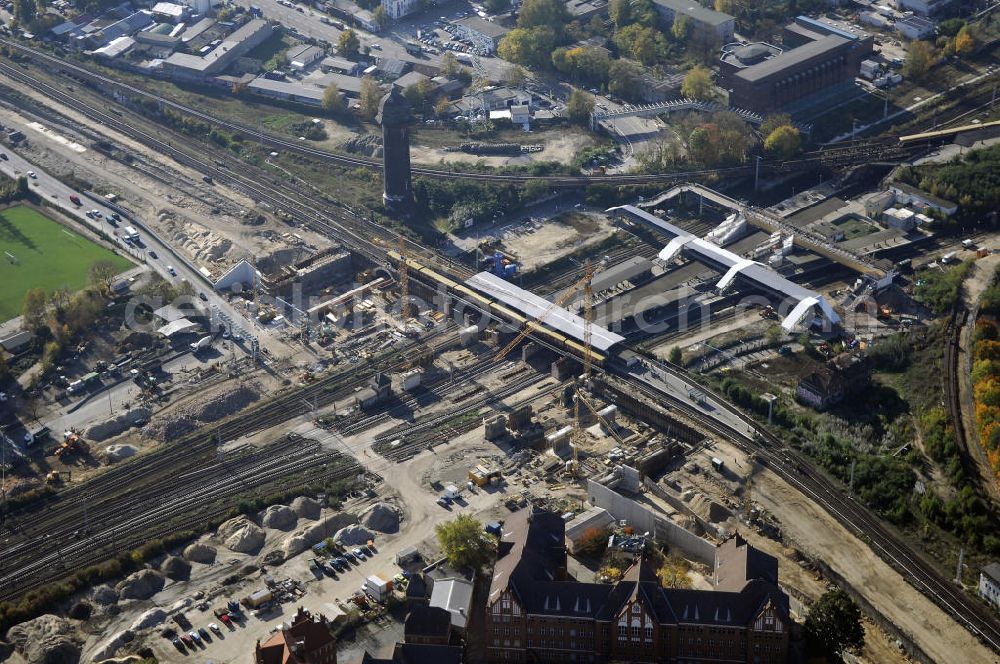 Aerial photograph Berlin - Blick auf den Um- und Neubau des Berliner S-Bahnhofs Ostkreuz. Der Bahnhof wurde bereits im Jahr 1882 eröffnet und ist somit stark sanierungsbedürftig. Die Arbeiten begannen im Oktober 2006. Teile der Neubauten führt die EUROVIA Beton GmbH aus. Weiterhin beteiligt ist das Unternehmen VEPRO Verkehrsbauprojekt GmbH. Kontakt EUROVIA: EUROVIA BEton GmbH, Niederlassung Ingenieurbau und Zweigniederlassung Cottbus, Gewerbeparkstraße 17, 03099 Kolkwitz, Tel. +49(0)355 35552 3, Fax +49(0)355 35552 52, EMail: ingenieurbau@eurovia.de; Kontakt VEPRO: Verkehrsbau Projekt GmbH, Storkower Str. 132, 10407 Berlin, Tel. +49(0)30 42194 0, Fax +49(0)30 42194 221