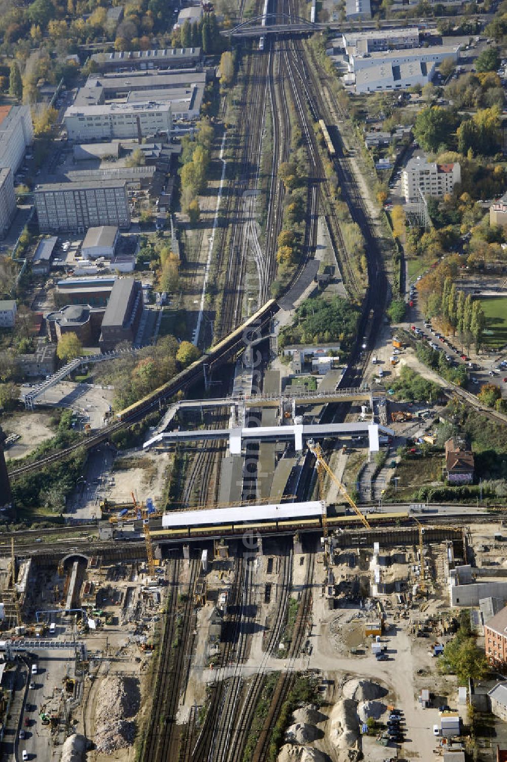 Aerial photograph Berlin - Blick auf den Um- und Neubau des Berliner S-Bahnhofs Ostkreuz. Der Bahnhof wurde bereits im Jahr 1882 eröffnet und ist somit stark sanierungsbedürftig. Die Arbeiten begannen im Oktober 2006. Teile der Neubauten führt die EUROVIA Beton GmbH aus. Weiterhin beteiligt ist das Unternehmen VEPRO Verkehrsbauprojekt GmbH. Kontakt EUROVIA: EUROVIA BEton GmbH, Niederlassung Ingenieurbau und Zweigniederlassung Cottbus, Gewerbeparkstraße 17, 03099 Kolkwitz, Tel. +49(0)355 35552 3, Fax +49(0)355 35552 52, EMail: ingenieurbau@eurovia.de; Kontakt VEPRO: Verkehrsbau Projekt GmbH, Storkower Str. 132, 10407 Berlin, Tel. +49(0)30 42194 0, Fax +49(0)30 42194 221