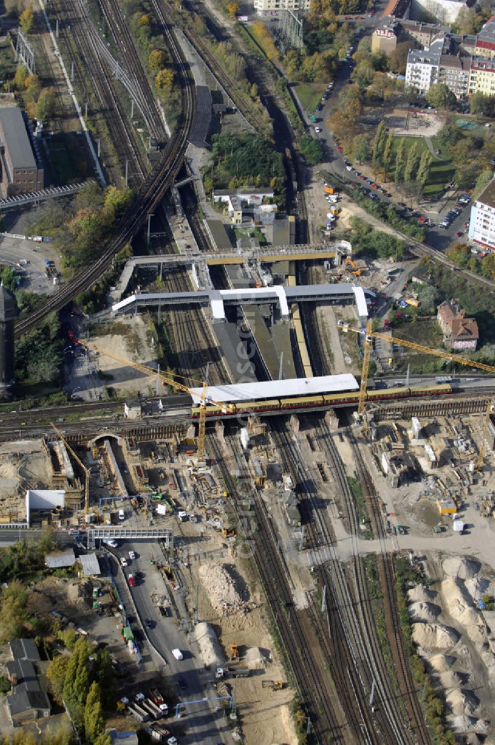 Aerial photograph Berlin - Blick auf den Um- und Neubau des Berliner S-Bahnhofs Ostkreuz. Der Bahnhof wurde bereits im Jahr 1882 eröffnet und ist somit stark sanierungsbedürftig. Die Arbeiten begannen im Oktober 2006. Teile der Neubauten führt die EUROVIA Beton GmbH aus. Weiterhin beteiligt ist das Unternehmen VEPRO Verkehrsbauprojekt GmbH. Kontakt EUROVIA: EUROVIA BEton GmbH, Niederlassung Ingenieurbau und Zweigniederlassung Cottbus, Gewerbeparkstraße 17, 03099 Kolkwitz, Tel. +49(0)355 35552 3, Fax +49(0)355 35552 52, EMail: ingenieurbau@eurovia.de; Kontakt VEPRO: Verkehrsbau Projekt GmbH, Storkower Str. 132, 10407 Berlin, Tel. +49(0)30 42194 0, Fax +49(0)30 42194 221