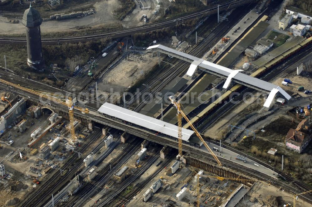 Aerial photograph Berlin - Blick auf den Um- und Neubau des Berliner S-Bahnhofs Ostkreuz. Der Bahnhof wurde bereits im Jahr 1882 eröffnet und ist somit stark sanierungsbedürftig. Teile der Neubauten führt die EUROVIA Beton GmbH aus. Weiterhin beteiligt ist das Unternehmen VEPRO Verkehrsbauprojekt GmbH. Kontakt EUROVIA: EUROVIA BEton GmbH, Niederlassung Ingenieurbau und Zweigniederlassung Cottbus, Gewerbeparkstraße 17, 03099 Kolkwitz, Tel. +49(0)355 35552 3, Fax +49(0)355 35552 52, EMail: ingenieurbau@eurovia.de; Kontakt VEPRO: Verkehrsbau Projekt GmbH, Storkower Str. 132, 10407 Berlin, Tel. +49(0)30 42194 0, Fax +49(0)30 42194 221