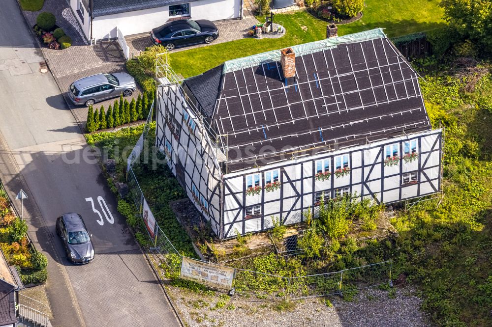 Aerial photograph Bestwig - Construction for the renovation and expansion of the old building Gasthof Alte Post to a complex with condominiums on place Marktplatz in the district Ostwig in Bestwig at Sauerland in the state North Rhine-Westphalia, Germany