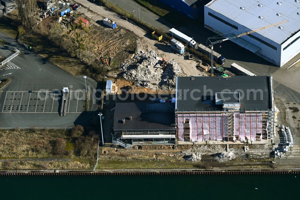 Aerial photograph Hannover - Construction site for reconstruction and modernization and renovation of an office and commercial building Hannover Docks in the district Limmer in Hannover in the state Lower Saxony, Germany