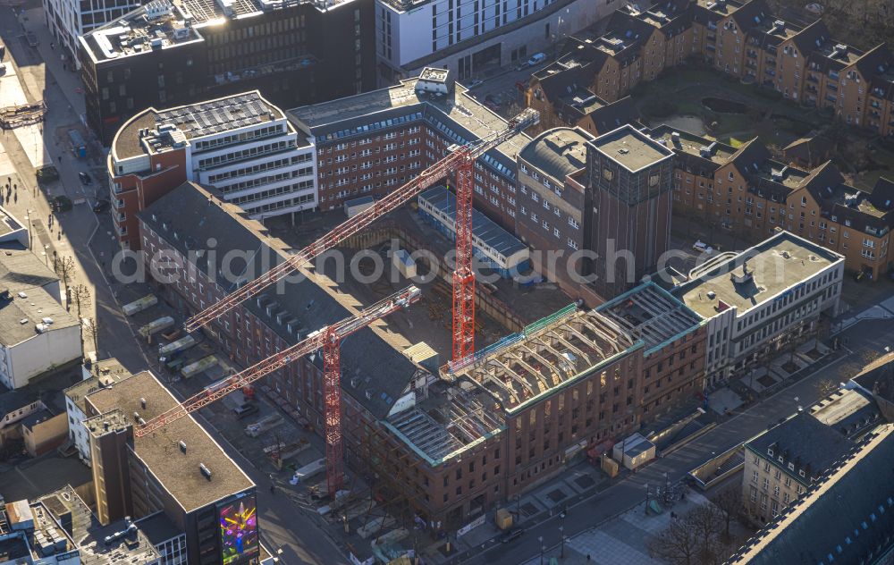 Aerial photograph Bochum - Construction site for reconstruction and modernization and renovation of an office and commercial building Haus of Wissens (HdW) on place Willy-Brandt-Platz in Bochum at Ruhrgebiet in the state North Rhine-Westphalia, Germany