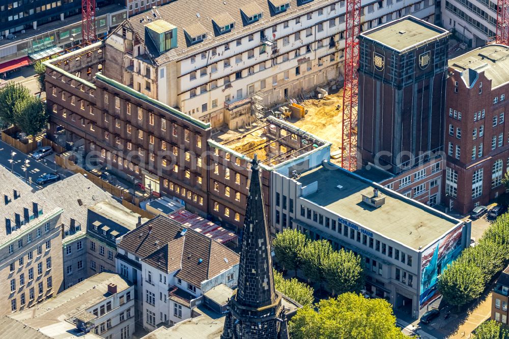 Bochum from the bird's eye view: Construction site for reconstruction and modernization and renovation of an office and commercial building Haus of Wissens (HdW) on place Willy-Brandt-Platz in Bochum at Ruhrgebiet in the state North Rhine-Westphalia, Germany