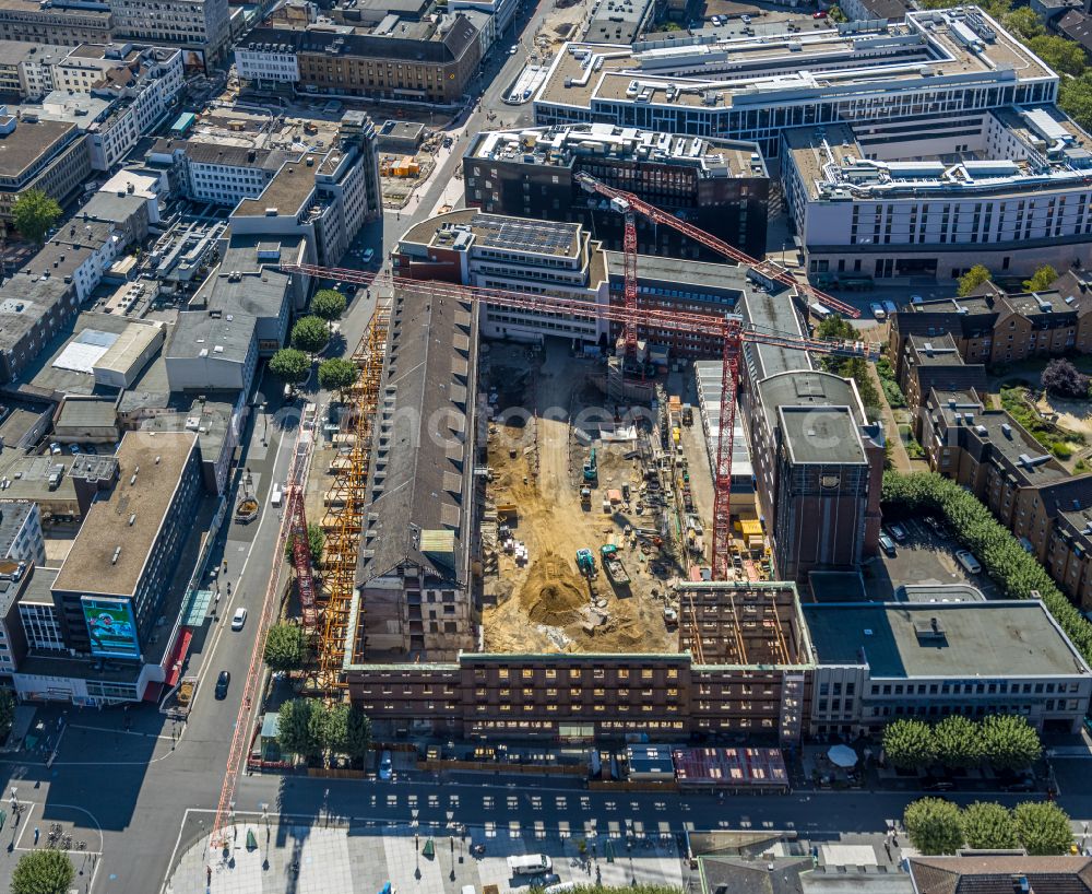 Aerial photograph Bochum - Construction site for reconstruction and modernization and renovation of an office and commercial building Haus of Wissens (HdW) on place Willy-Brandt-Platz in Bochum at Ruhrgebiet in the state North Rhine-Westphalia, Germany