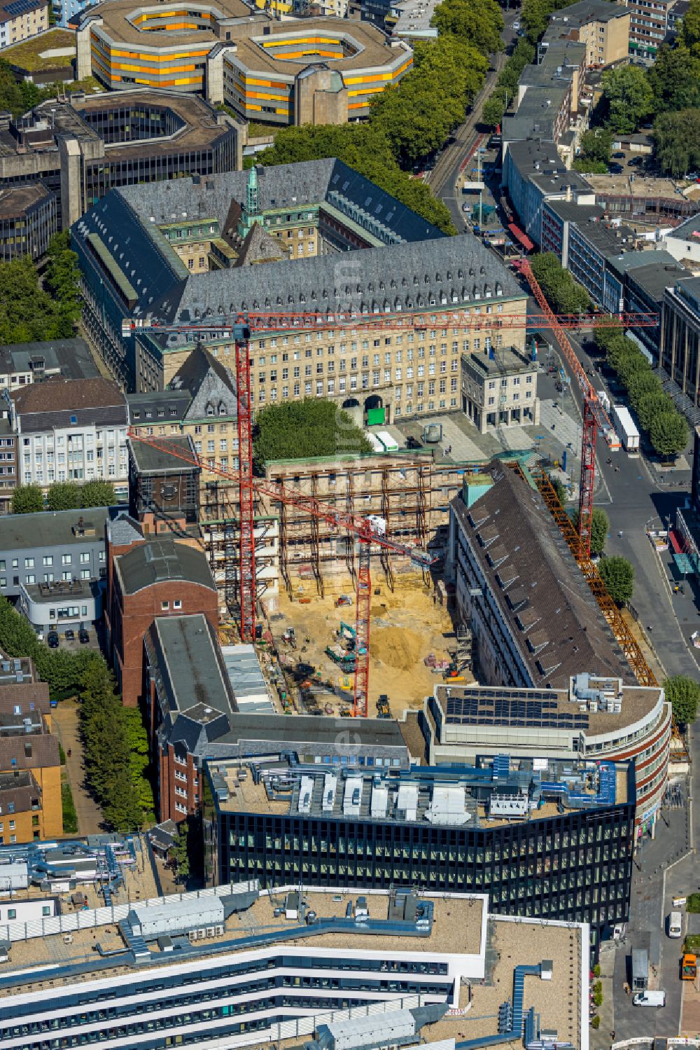 Bochum from the bird's eye view: Construction site for reconstruction and modernization and renovation of an office and commercial building Haus of Wissens (HdW) on place Willy-Brandt-Platz in Bochum at Ruhrgebiet in the state North Rhine-Westphalia, Germany