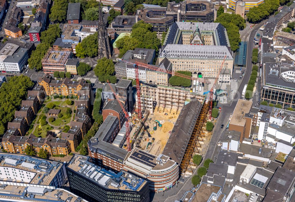 Aerial photograph Bochum - Construction site for reconstruction and modernization and renovation of an office and commercial building Haus of Wissens (HdW) on place Willy-Brandt-Platz in Bochum at Ruhrgebiet in the state North Rhine-Westphalia, Germany