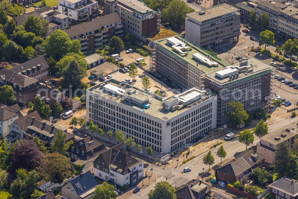 Bottrop from the bird's eye view: Construction site for the conversion and modernization of an office and commercial building of the RAG building to the Bauknecht Quartier on Hans-Boeckler-Strasse in the district of Stadtmitte in Bottrop in the Ruhr area in the state of North Rhine-Westphalia, Germany