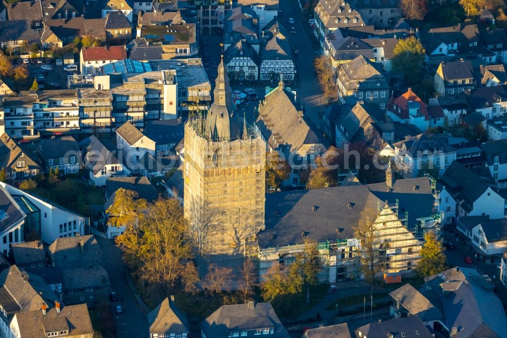 Brilon from the bird's eye view: Construction site for reconstruction and modernization and renovation of a church building of Probsteikirche on Schulstrasse in Brilon in the state North Rhine-Westphalia, Germany