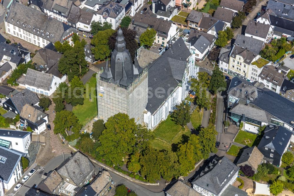 Brilon from above - Construction site for reconstruction and modernization and renovation of a church building of Probsteikirche on Schulstrasse in Brilon in the state North Rhine-Westphalia, Germany