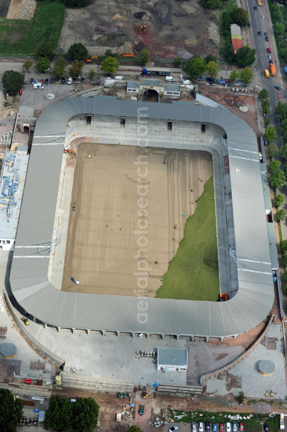 Aerial photograph Halle / Saale - Umbau des Kurt-Wabbel-Stadions in den neuen Erdgas Sportpark in Halle. Das Stadion erhält erweiterte und umgebaute Ränge. Reconstruction of the football stadium Halle.