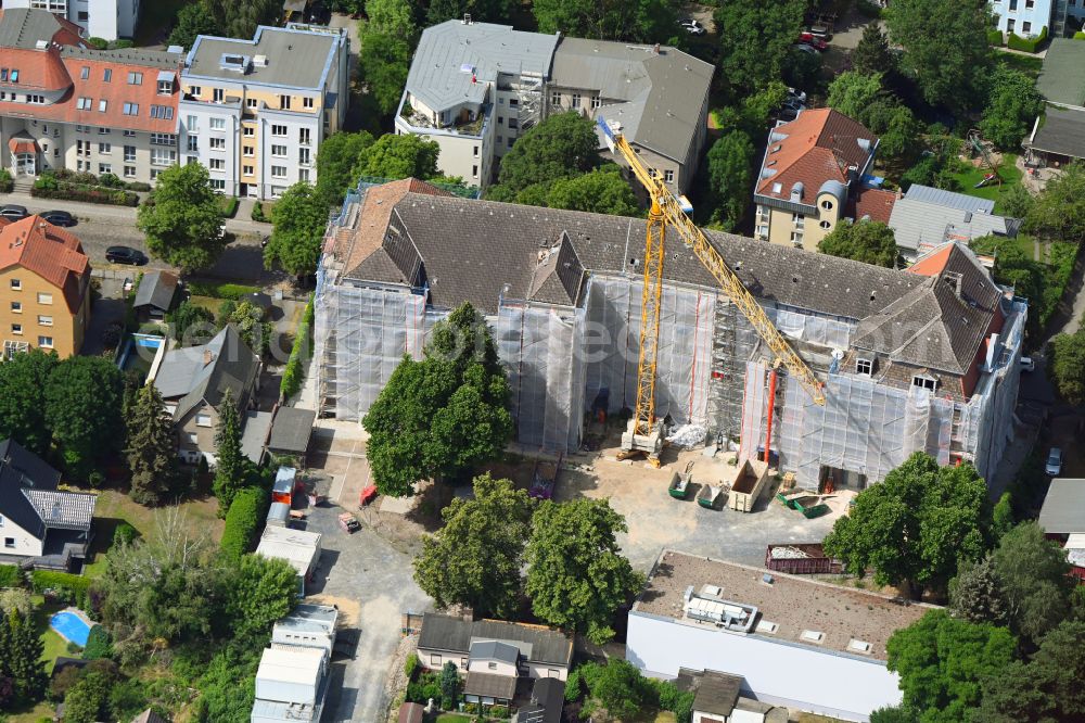 Berlin from the bird's eye view: Construction sites for the conversion, expansion and modernization of the school building of Hasengrund-Schule on street Charlottenstrasse in Berlin, Germany