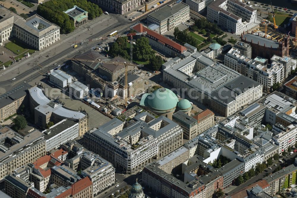 Berlin from above - View of the reconstruction and renovation of the building of the Staatsoper Unter den Linden in Berlin at Bebelplatz. It is the oldest opera house and theater building in Berlin. A new building will serve as stacks and warehouse for the Staatsoper Komplex. The architect HG Merz is a overseeing the reconstruction of the historical building complex