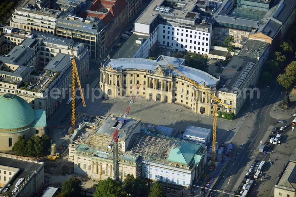 Aerial photograph Berlin - View of the reconstruction and renovation of the building of the Staatsoper Unter den Linden in Berlin at Bebelplatz. It is the oldest opera house and theater building in Berlin. According to the architect HG Merz is a reconstruction of the historical building complex