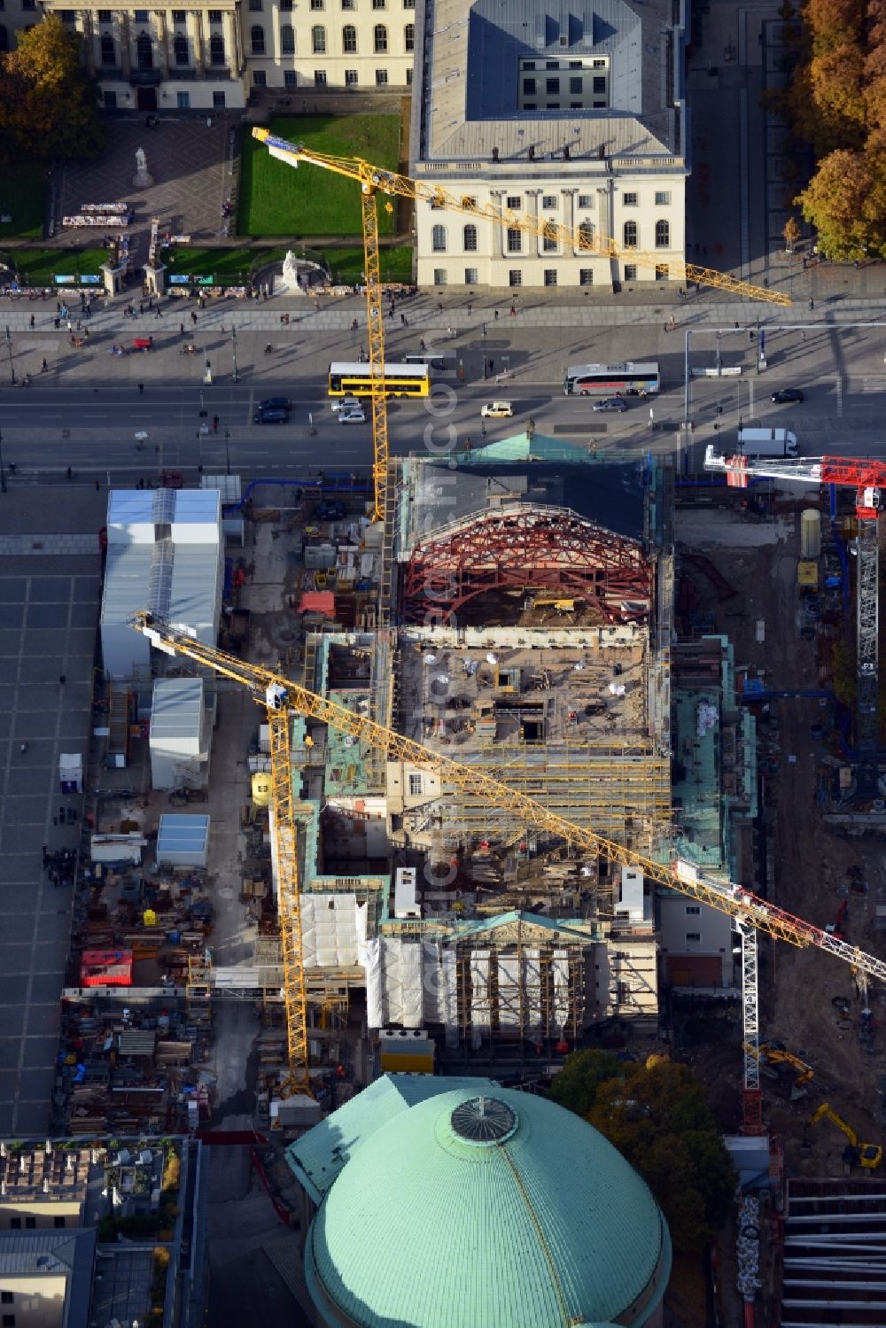 Berlin from above - View of the reconstruction and renovation of the building of the Staatsoper Unter den Linden in Berlin at Bebelplatz. It is the oldest opera house and theater building in Berlin. A new building will serve as stacks and warehouse for the Staatsoper Komplex. The architect HG Merz is a overseeing the reconstruction of the historical building complex