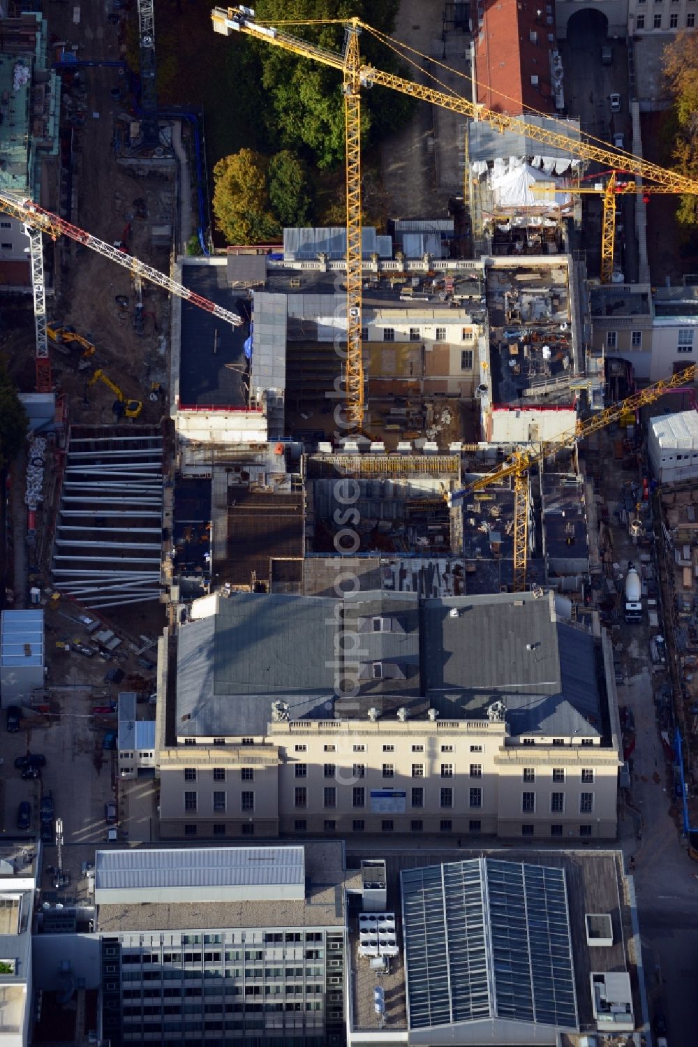 Berlin from the bird's eye view: View of the reconstruction and renovation of the building of the Staatsoper Unter den Linden in Berlin at Bebelplatz. It is the oldest opera house and theater building in Berlin. A new building will serve as stacks and warehouse for the Staatsoper Komplex. The architect HG Merz is a overseeing the reconstruction of the historical building complex