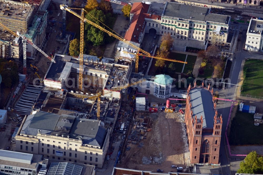 Berlin from the bird's eye view: View of the reconstruction and renovation of the building of the Staatsoper Unter den Linden in Berlin at Bebelplatz. It is the oldest opera house and theater building in Berlin. A new building will serve as stacks and warehouse for the Staatsoper Komplex. The architect HG Merz is a overseeing the reconstruction of the historical building complex