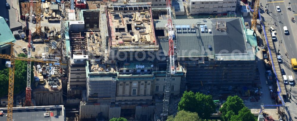 Berlin from above - View of the reconstruction and renovation of the building of the Staatsoper Unter den Linden in Berlin at Bebelplatz. It is the oldest opera house and theater building in Berlin. A new building will serve as stacks and warehouse for the Staatsoper Komplex. The architect HG Merz is a overseeing the reconstruction of the historical building complex