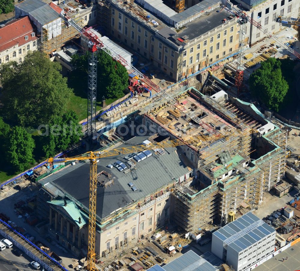 Berlin from above - View of the reconstruction and renovation of the building of the Staatsoper Unter den Linden in Berlin at Bebelplatz. It is the oldest opera house and theater building in Berlin. A new building will serve as stacks and warehouse for the Staatsoper Komplex. The architect HG Merz is a overseeing the reconstruction of the historical building complex