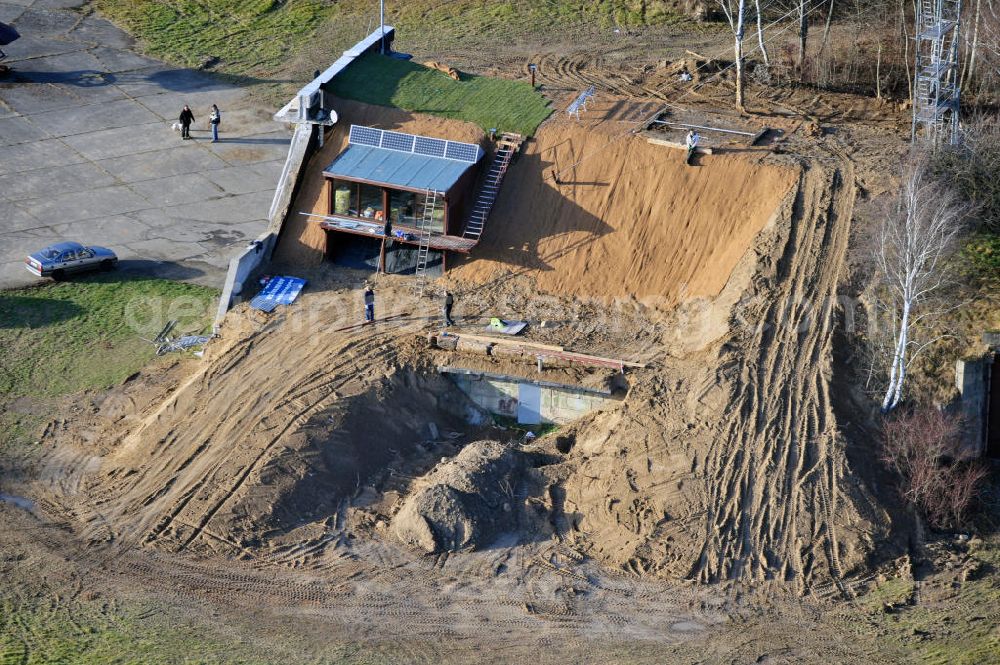 Werneuchen from above - Zivile Nutzung / Konversion der alten Shelter / Flugzeughallen am Flugplatz Werneuchen. Umbau und Erweiterung eines Shelters mit umfangreichen Erdarbeiten zur Trockenlegung / Isolierung der Betonwände. Der Flugplatz diente seit den 1930er Jahren als Fliegerhorst und wurde danach von der Sowjetarmee als Flugplatz für Jagdbomber genutzt. Civilian use of the facilities of the airfield Werneuchen.