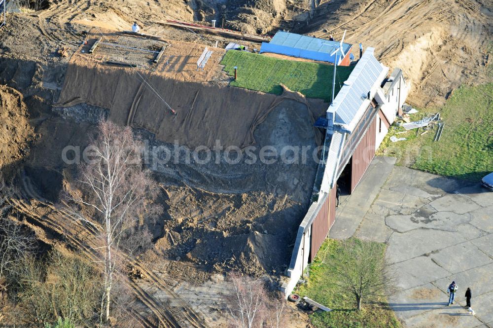 Werneuchen from above - Zivile Nutzung / Konversion der alten Shelter / Flugzeughallen am Flugplatz Werneuchen. Umbau und Erweiterung eines Shelters mit umfangreichen Erdarbeiten zur Trockenlegung / Isolierung der Betonwände. Der Flugplatz diente seit den 1930er Jahren als Fliegerhorst und wurde danach von der Sowjetarmee als Flugplatz für Jagdbomber genutzt. Civilian use of the facilities of the airfield Werneuchen.