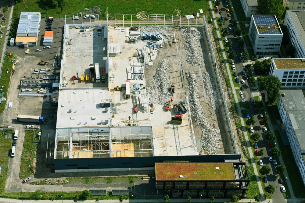 Berlin from the bird's eye view: Construction site for the conversion of the buildings and production halls on the factory premises of Soltecture GmbH at Gross-Berliner Damm - Pfarrer-Goosmann-Strasse - Georg-Schendel-Strasse in Berlin, Germany