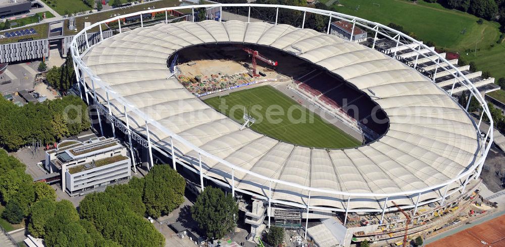 Stuttgart from the bird's eye view: Blick auf die Umbauarbeiten am Stadion Stuttgart( Mercedes-Benz-Arena) zu einem reinen Fußballstadion. Während des Umbaus, Bauherr ist die Stadion NeckarPark GmbH & Co. KG, wird sich die Kapazität auf 39.000 Plätze reduzieren, die Kosten des Projekts belaufen sich auf rund 60 Millionen Euro. Für zusätzliche 13,15 Millionen Euro wird außerdem unter der Untertürkheimer Kurve eine Sporthalle entstehen. Ausführende Firma ist die BAM Deutschland AG. View of the reconstruction of the stadium Stuttgart (Mercedes-Benz-Arena) to a football-only stadium.