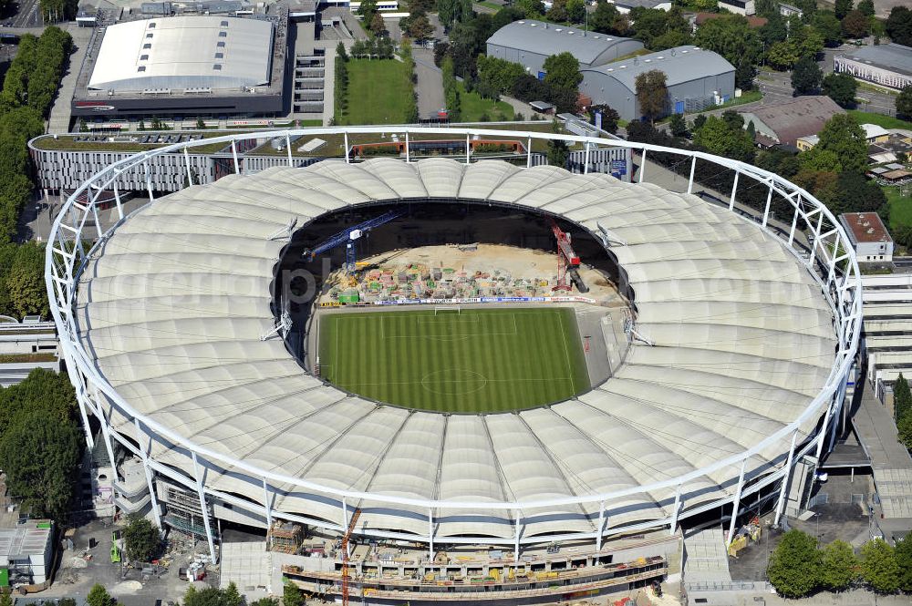 Aerial photograph Stuttgart - Blick auf die Umbauarbeiten am Stadion Stuttgart( Mercedes-Benz-Arena) zu einem reinen Fußballstadion. Während des Umbaus, Bauherr ist die Stadion NeckarPark GmbH & Co. KG, wird sich die Kapazität auf 39.000 Plätze reduzieren, die Kosten des Projekts belaufen sich auf rund 60 Millionen Euro. Für zusätzliche 13,15 Millionen Euro wird außerdem unter der Untertürkheimer Kurve eine Sporthalle entstehen. Ausführende Firma ist die BAM Deutschland AG. View of the reconstruction of the stadium Stuttgart (Mercedes-Benz-Arena) to a football-only stadium.