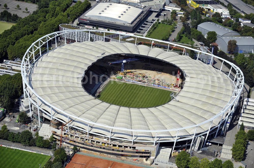 Stuttgart from the bird's eye view: Blick auf die Umbauarbeiten am Stadion Stuttgart( Mercedes-Benz-Arena) zu einem reinen Fußballstadion. Während des Umbaus, Bauherr ist die Stadion NeckarPark GmbH & Co. KG, wird sich die Kapazität auf 39.000 Plätze reduzieren, die Kosten des Projekts belaufen sich auf rund 60 Millionen Euro. Für zusätzliche 13,15 Millionen Euro wird außerdem unter der Untertürkheimer Kurve eine Sporthalle entstehen. Ausführende Firma ist die BAM Deutschland AG. View of the reconstruction of the stadium Stuttgart (Mercedes-Benz-Arena) to a football-only stadium.