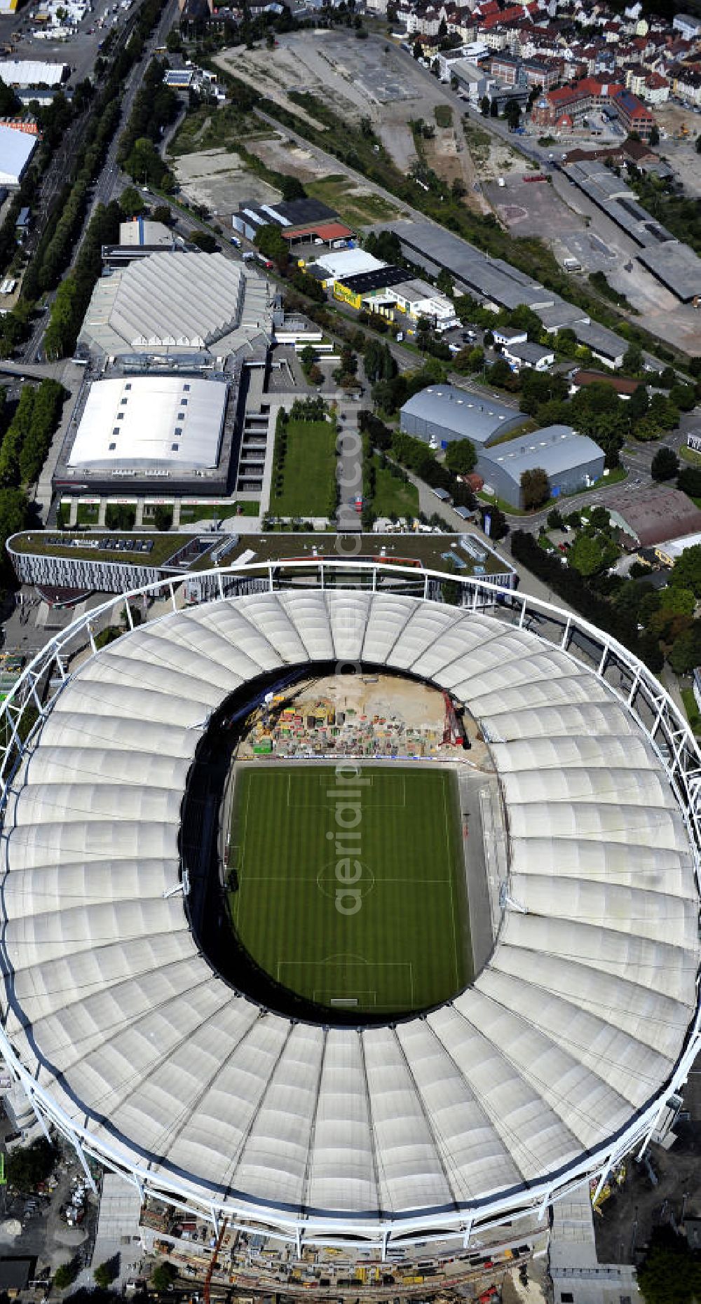 Aerial image Stuttgart - Blick auf die Umbauarbeiten am Stadion Stuttgart( Mercedes-Benz-Arena) zu einem reinen Fußballstadion. Während des Umbaus, Bauherr ist die Stadion NeckarPark GmbH & Co. KG, wird sich die Kapazität auf 39.000 Plätze reduzieren, die Kosten des Projekts belaufen sich auf rund 60 Millionen Euro. Für zusätzliche 13,15 Millionen Euro wird außerdem unter der Untertürkheimer Kurve eine Sporthalle entstehen. Ausführende Firma ist die BAM Deutschland AG. View of the reconstruction of the stadium Stuttgart (Mercedes-Benz-Arena) to a football-only stadium.