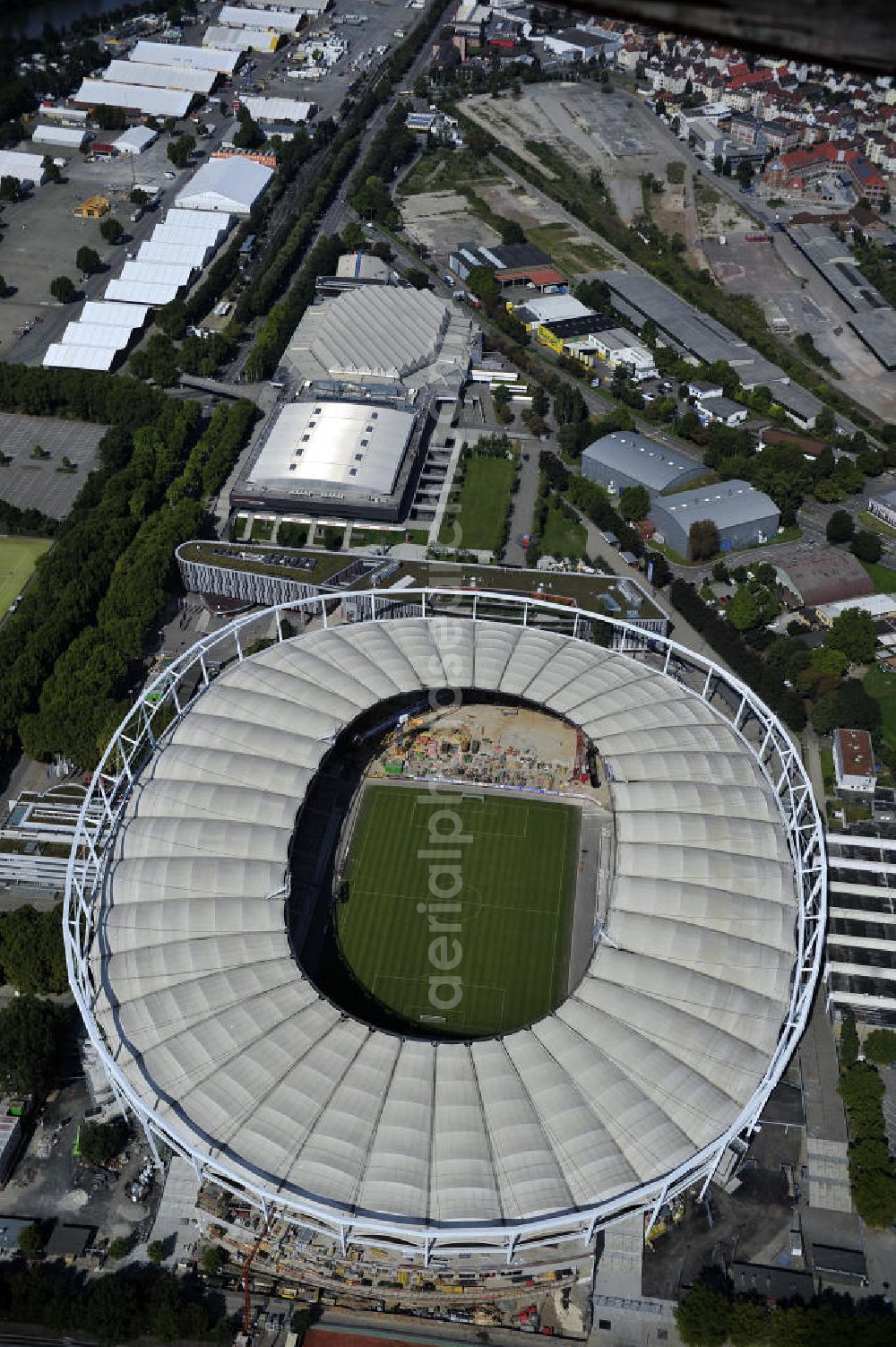 Aerial photograph Stuttgart - Blick auf die Umbauarbeiten am Stadion Stuttgart( Mercedes-Benz-Arena) zu einem reinen Fußballstadion. Während des Umbaus, Bauherr ist die Stadion NeckarPark GmbH & Co. KG, wird sich die Kapazität auf 39.000 Plätze reduzieren, die Kosten des Projekts belaufen sich auf rund 60 Millionen Euro. Für zusätzliche 13,15 Millionen Euro wird außerdem unter der Untertürkheimer Kurve eine Sporthalle entstehen. Ausführende Firma ist die BAM Deutschland AG. View of the reconstruction of the stadium Stuttgart (Mercedes-Benz-Arena) to a football-only stadium.