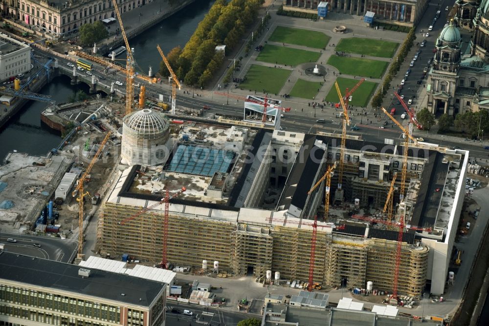 Berlin from above - Construction site for the new building the largest and most important cultural construction of the Federal Republic, the building of the Humboldt Forum in the form of the Berlin Palace