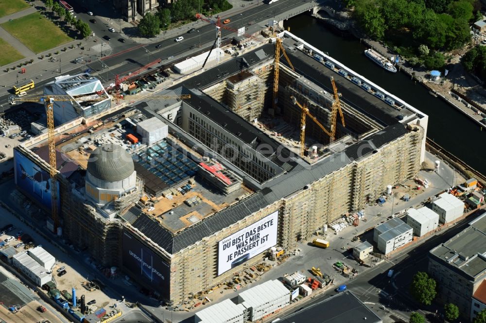 Berlin from above - Construction site for the new building the largest and most important cultural construction of the Federal Republic, the building of the Humboldt Forum in the form of the Berlin Palace