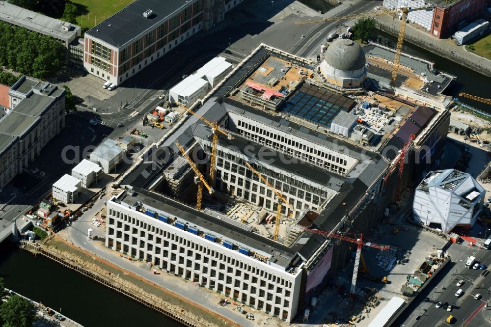 Berlin from above - Construction site for the new building the largest and most important cultural construction of the Federal Republic, the building of the Humboldt Forum in the form of the Berlin Palace