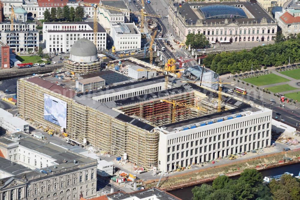 Berlin from above - Construction site for the new building the largest and most important cultural construction of the Federal Republic, the building of the Humboldt Forum in the form of the Berlin Palace