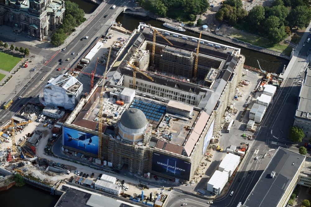 Berlin from above - Construction site for the new building the largest and most important cultural construction of the Federal Republic, the building of the Humboldt Forum in the form of the Berlin Palace