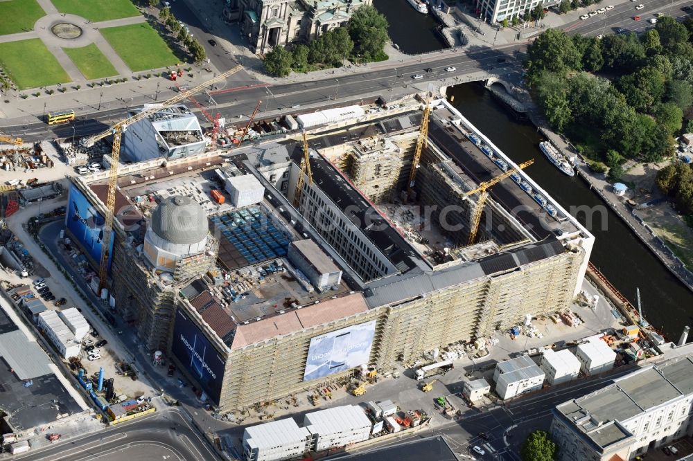 Berlin from above - Construction site for the new building the largest and most important cultural construction of the Federal Republic, the building of the Humboldt Forum in the form of the Berlin Palace